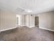 Basement showcasing neutral walls, carpet, doors to other rooms and access to other areas of the house at 927 Dean Patrick Rd, Locust Grove, GA 30248
