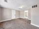 Basement with neutral walls, carpet, multiple access doors and a utility connection at 927 Dean Patrick Rd, Locust Grove, GA 30248