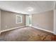 Bedroom featuring neutral walls, carpet flooring, and a view into an adjacent bathroom space at 927 Dean Patrick Rd, Locust Grove, GA 30248