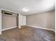 Bedroom with neutral walls, carpet flooring, and closet, providing ample space and storage at 927 Dean Patrick Rd, Locust Grove, GA 30248
