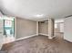 Spacious bedroom with neutral walls, carpet flooring, and adjacent spaces, bathroom and closet at 927 Dean Patrick Rd, Locust Grove, GA 30248