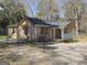 Cozy home featuring a fenced yard, brick facade, and inviting front porch at 927 Dean Patrick Rd, Locust Grove, GA 30248