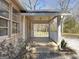 Inviting front porch with brick accents and ample space to enjoy the outdoors at 927 Dean Patrick Rd, Locust Grove, GA 30248