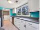 Stylish kitchen with stainless steel appliances and white cabinets, adjacent laundry area at 927 Dean Patrick Rd, Locust Grove, GA 30248