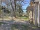 Side yard featuring a chain link fence and grassy area at 927 Dean Patrick Rd, Locust Grove, GA 30248