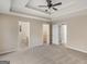 Bright main bedroom with neutral walls, plush carpeting, and ensuite bathroom and walk-in closet access at 124 Williams Blf, Mcdonough, GA 30252