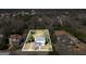 Aerial view of a charming home with mature trees, showcasing the property's layout and curb appeal at 76 College St, Mcdonough, GA 30253