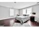 Bright bedroom with wood floors, a fireplace, and natural light at 76 College St, Mcdonough, GA 30253