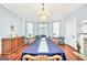 Elegant dining room with hardwood floors, chandelier, and large table, perfect for entertaining guests at 76 College St, Mcdonough, GA 30253