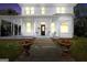 Beautiful two-story home with a classic front porch, complemented by well-lit windows at 76 College St, Mcdonough, GA 30253