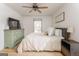 Bright bedroom featuring hardwood floors, dresser and ceiling fan at 3529 Essex Ave # 75, Atlanta, GA 30339