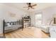 Bright Bedroom with hardwood floors, crib, and white furniture at 3529 Essex Ave # 75, Atlanta, GA 30339