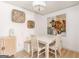 Cozy dining area featuring light wood floors, built-in bench and a modern chandelier at 3529 Essex Ave # 75, Atlanta, GA 30339