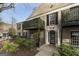 Charming brick condo building featuring a private balcony and manicured landscaping at 3529 Essex Ave # 75, Atlanta, GA 30339