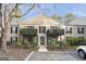 Charming two-story condo featuring brick facade, black shutters, and inviting outdoor balconies at 3529 Essex Ave # 75, Atlanta, GA 30339