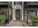 Inviting entrance with black trimmed windows, railings, and door with the building number displayed above it at 3529 Essex Ave # 75, Atlanta, GA 30339