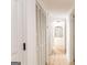 Bright hallway with wood flooring and white doors and trim at 3529 Essex Ave # 75, Atlanta, GA 30339