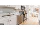 Bright kitchen with stainless steel appliances and white cabinets at 3529 Essex Ave # 75, Atlanta, GA 30339