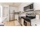 Efficient kitchen with stainless steel appliances and neutral cabinets at 3529 Essex Ave # 75, Atlanta, GA 30339
