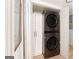 Convenient laundry closet equipped with a modern stacked washer and dryer unit at 3529 Essex Ave # 75, Atlanta, GA 30339