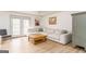 Bright living room featuring wood floors, a sectional, modern decor and French doors at 3529 Essex Ave # 75, Atlanta, GA 30339