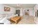 Bright living room with light-colored wood floors, white sofa and white walls at 3529 Essex Ave # 75, Atlanta, GA 30339