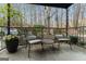 Comfortable porch setting with seating, string lights and a serene view of trees at 3529 Essex Ave # 75, Atlanta, GA 30339