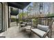 Relaxing outdoor porch area featuring seating, string lights, and private wooded views at 3529 Essex Ave # 75, Atlanta, GA 30339
