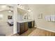A bathroom featuring double sinks and a view into the main bedroom at 2377 Aukerman Trce # 82, Hampton, GA 30228