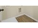 A laundry area with light wood flooring and a washer and dryer hookups at 2377 Aukerman Trce # 82, Hampton, GA 30228
