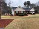 A well maintained brick home with manicured landscaping and lawn at 215 Buck Run, Loganville, GA 30052