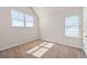 Bedroom with natural light coming through two large windows, neutral walls and carpet at 7754 Hansel Ln, Lithonia, GA 30058