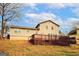 Exterior view of a house with a wooden deck and spacious backyard, ideal for entertaining at 4161 Windermere Dr, Lithonia, GA 30038
