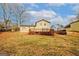 Home with a large backyard, wooden deck, and grassy area, perfect for outdoor activities at 4161 Windermere Dr, Lithonia, GA 30038