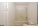 A clean white bathroom features a bathtub/shower combo, toilet, and a vanity at 4161 Windermere Dr, Lithonia, GA 30038