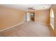 Spacious bedroom featuring carpeted flooring, neutral walls, and access to a bathroom at 4161 Windermere Dr, Lithonia, GA 30038