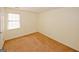 Well-lit bedroom with a window and plush carpet, ready for your personal touches at 4161 Windermere Dr, Lithonia, GA 30038
