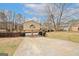 Charming split-level home featuring an attached two-car garage and a spacious driveway at 4161 Windermere Dr, Lithonia, GA 30038