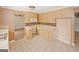 Functional kitchen features ample counter space, tile flooring, and a mosaic tile backsplash at 4161 Windermere Dr, Lithonia, GA 30038