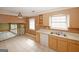 Open-concept kitchen and dining area with tile flooring, ceiling fan, and natural light at 4161 Windermere Dr, Lithonia, GA 30038