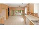 Open-concept kitchen with tile flooring, a ceiling fan, and views of the living area at 4161 Windermere Dr, Lithonia, GA 30038