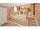 Open layout combining kitchen and living areas, with tile flooring and stairway access at 4161 Windermere Dr, Lithonia, GA 30038
