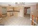 Spacious kitchen area with neutral color scheme, tile flooring, and ample cabinet space at 4161 Windermere Dr, Lithonia, GA 30038