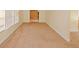 Bright living room with neutral carpet leads to other rooms at 4161 Windermere Dr, Lithonia, GA 30038