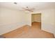 Inviting living room boasts wainscotting, ceiling fan and neutral carpet at 4161 Windermere Dr, Lithonia, GA 30038