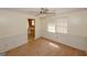 Cozy living room features ceiling fan, wainscotting and leads into a kitchen at 4161 Windermere Dr, Lithonia, GA 30038