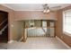 Open living room showcasing a fireplace and tile floors, with railing overlooking the space at 4161 Windermere Dr, Lithonia, GA 30038