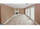 Bright living room features a fireplace and glass-paneled doors leading to the exterior at 4161 Windermere Dr, Lithonia, GA 30038