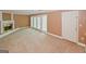 Spacious living room featuring a cozy fireplace and decorative glass doors at 4161 Windermere Dr, Lithonia, GA 30038