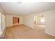 Spacious living room featuring large windows for natural light and access to other areas at 4161 Windermere Dr, Lithonia, GA 30038